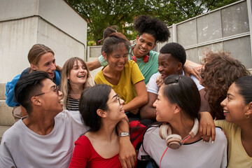 A group of students having fun outside. Happy classmates at the high school. Back to school together again.