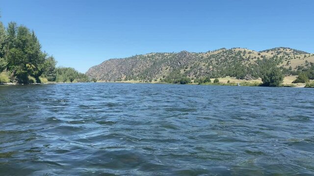 Blue calm river on windy day in a desert valley of Montana