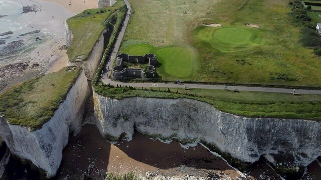 Aerial Over White Chalk Cliffs And Neptune's Tower At Kingsgate Bay. High Angle, Dolly Left