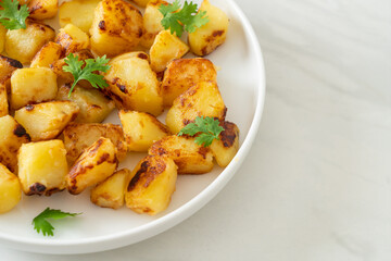 Fototapeta premium Roasted or grilled potatoes on plate