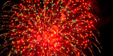 Fireworks light up  at New Year Eve. Abstract Festive background with fireworks sparkles. Copyspace.