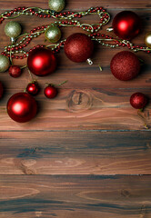 Top view shot of Christmas festival and happy new year eve decorative ornament items on old dark wooden table with copy space