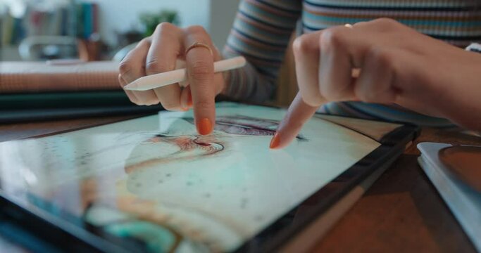 close up hands woman graphic designer using tablet computer drawing digital art illustration graphic artist sketching on touchscreen device with stylus pen