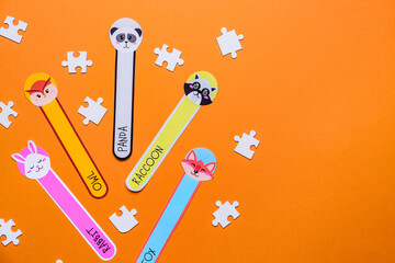 Cute bookmarks with puzzle pieces on color background