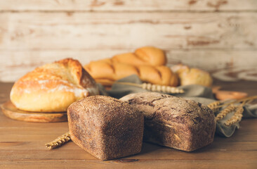 Fresh bread on wooden table