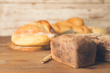 Fresh bread on wooden table