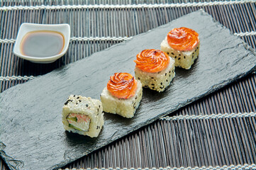 delicious baked crab rolls on a stone stand