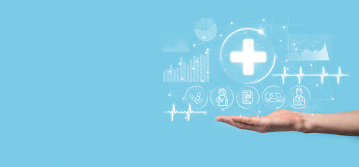 Fototapeta premium Businessman hold virtual plus medical network connection icons. Covid-19 pandemic develop people awareness and spread attention on their healthcare.Doctor,document,medicine,ambulance,patient icon.