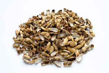 Pile of peanut shells on white