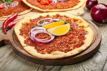 Delicious Turkish pizza on wooden background