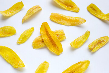 Banana slice chips on white background © Bowonpat