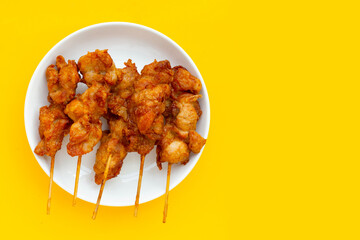 Fried crispy chicken skewers, Thai style street food