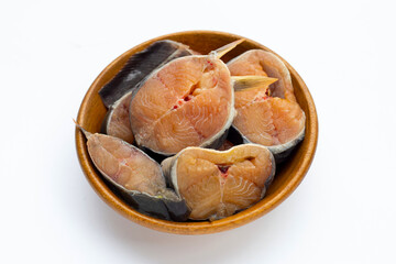 Catfish cut pieces in bowon bowl on white background.