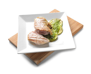Grilled chicken meat and zucchini with pesto sauce on white background