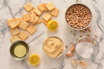 Composition with tasty hummus and crackers on light background