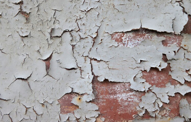 Peeling paint on a metal surface.