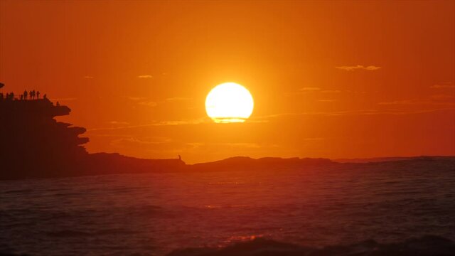 The sun rises over the ocean at Bondi Beach. (Shot on RED).Sunrise on Bondi Beach, Sydney Australia.Sunrise View.High quality. Bondi Beach Morning.