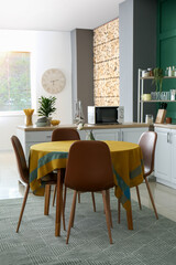 Interior of stylish kitchen with dining table
