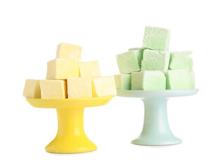 Dessert stands with tasty sweet marshmallows on white background