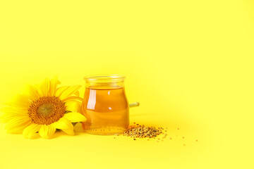 Jar of honey on color background