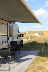 a new mobile home with awning and table and chairs