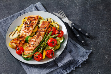 grilled salmon and vegetables on a plate