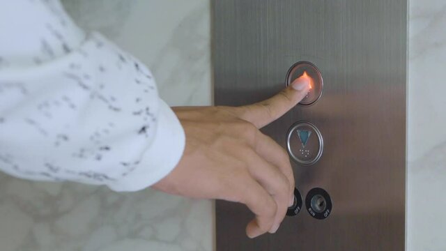 Man pressing elevator button,Finger pressing elevator button