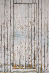 Wood wall background texture with with a door in soft lighting