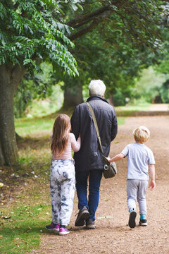 Grandparents With Children On A Day Out For A Walk