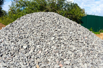 A pile of rubble on a construction site, gray stones