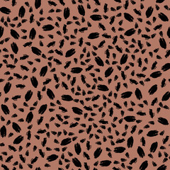 Seamless vector pattern of black spots on brown. Animal wildcat print for wallpaper, textile, other surface design. 