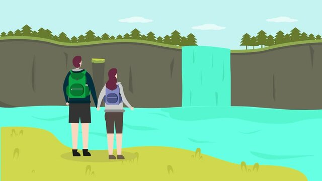 Young couple enjoying beautiful waterfall together