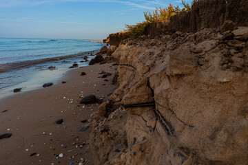 Sandy hill on the wild beach of the Black Sea coast on a clear summer day. Ukraine.