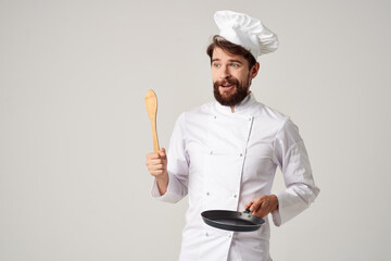 Naklejka premium cooks with a frying pan cooking food cooking service