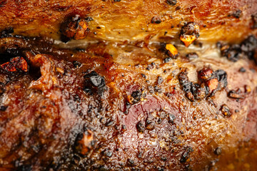 Macro closeup on grilled pepper beef steak texture background