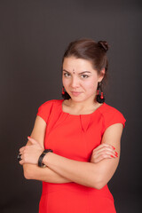 Obraz premium girl in a red dress on a black background
