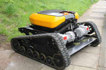 Robotic caterpillar tracked industrial mower, bush cutter. Heavy duty remote controlled lawn mower...