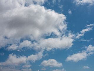 Fluffy clouds floating on blue sky