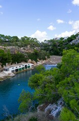 Fototapeta na wymiar Turquoise Majorcan cove with its typical houses