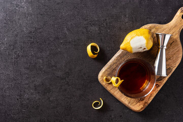 New Orleans sazerac cocktail on black background. Top view. Copy space