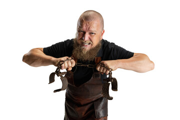 Close-up muscular bearded bald man, blacksmith wearing leather apron or uniform isolated on white...