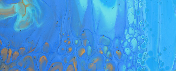 art photography of abstract marbleized effect background with blue and yellow creative colors. Beautiful paint.