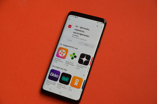 IVI mobile application is installed on a smartphone. IVI program on a mobile device. Online cinema on a mobile device. Selective focus, shallow depth of field.Moscow, Russia, 02.04.2021