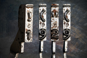 vintage old typewriter hammers with the date 1929  isolated