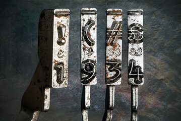 vintage old typewriter hammers with the date 1934  isolated