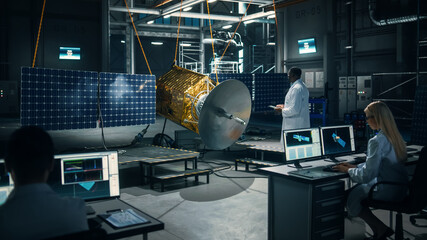 Team of Engineers Working on Satellite Construction. Aerospace Agency Spaceship Manufacturing...