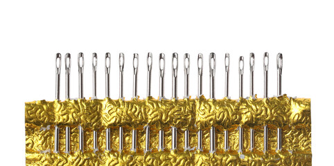 Set of sewing needles with package isolated on white, top view