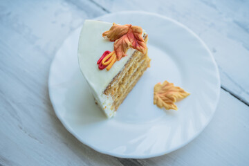 slice of cake decorated with autumn leaves