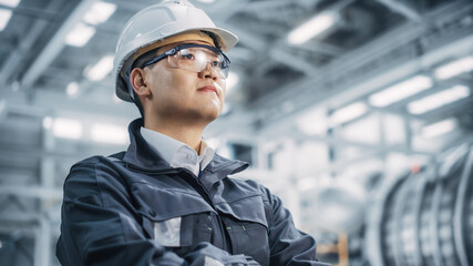 Portrait of a Professional Asian Heavy Industry Engineer/Worker Wearing Safety Uniform, Glasses and...