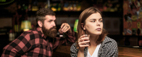 Young woman has problems with alcohol. Alcoholism, alcohol addiction, male alcoholic. Young man drinking alcohol. Female male alcoholism. Woman and man alcoholism. Woman alcoholic beverage in bar